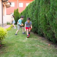 children easter egg hunting in a garden - garden decoration stock pictures, royalty-free photos & images