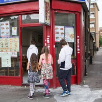 Children make their way into a fast food outlet in Tower Hamlets on August 10, 2015 in London, England.