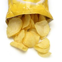 chips spilling out of an open bag - food stock pictures, royalty-free photos & images