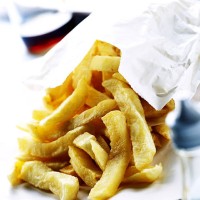 chips spilling out of paper bag - junk food stock pictures, royalty-free photos & images