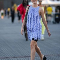 Chloé Ambre Maurin wears a pale purple sleeveless / embroidered fringed / short dress, black cyclist shorts, a black and beige FF monogram print...