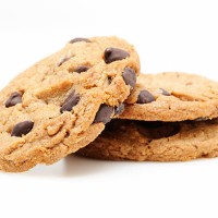 chocolate chip cookies on white - food stock pictures, royalty-free photos & images