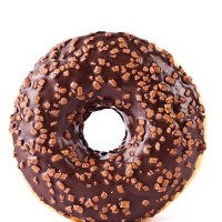 chocolate covered donut with nuts - junk food stock pictures, royalty-free photos & images