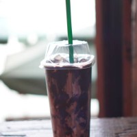 chocolate milk ice in plastic cup - junk food stock pictures, royalty-free photos & images