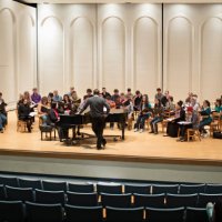 choir and conductor on stage - concert stock pictures, royalty-free photos & images