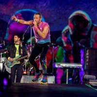 Chris Martin, Guy Berryman and Jonny Buckland of Coldplay perform live on stage at Parken Stadium on July 5, 2023 in Copenhagen, Denmark.
