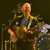 Chris Martin of Coldplay performs on the Pyramid stage during day four of Glastonbury Festival 2024 at Worthy Farm, Pilton on June 29, 2024 in...