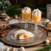 christmas dessert apricot strudel cake with advocaat eggnog and whipped cream in rustic wood kitchen - home decoration stock pictures, royalty-free photos & images