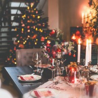 christmas dinner table at festive cozy room background with christmas tree - home decoration stock pictures, royalty-free photos & images