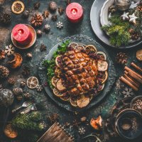 christmas dinner table with roasted pork ham , flavors, decoration and candles - food stock pictures, royalty-free photos & images