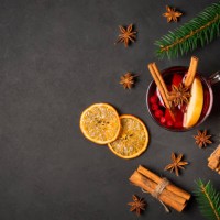 christmas flat lay background with cup of mulled red wine, fir tree, cinnamon, orange, spices and copy space - food stock pictures, royalty-free photos & images