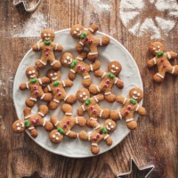christmas gingerbread cookies on a wooden table with molds. - home decoration stock pictures, royalty-free photos & images