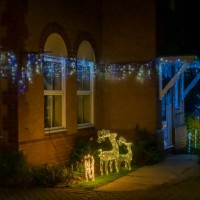 christmas lights on a suburban residential house - garden decoration stock pictures, royalty-free photos & images