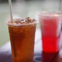 chrysanthemum water with ice in clear plastic cup - junk food stock pictures, royalty-free photos & images