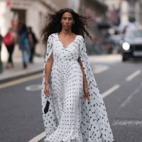 Ciinderella Balthazar was seen wearing black heels and a long white dress with lots of black polka dots as well as a gown, and a black bag with a...