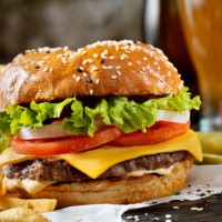 classic cheeseburger on a brioche bun with fries and a milkshake - junk food stock pictures, royalty-free photos & images