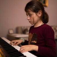 clever little girl learns the piano symphony. - concert stock pictures, royalty-free photos & images