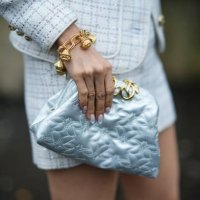Close-up detail view of a golden bracelet, and an Elie Saab pouch bag, outside Elie Saab, during the Womenswear Fall/Winter 2024/2025 as part of...