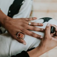 close-up of a black woman painting her fingernails brown - nails art stock pictures, royalty-free photos & images