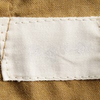 close-up of a blank white clothing label - fashion stock pictures, royalty-free photos & images