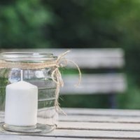 close-up of a candle in a glass. decoration service at a garden party, summer festival, or wedding. catering. - garden decoration stock pictures, royalty-free photos & images