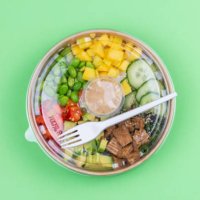 close-up of a healthy lunch in a plastic container on green background. - junk food stock pictures, royalty-free photos & images