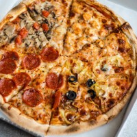 close-up of a take away pizza with different toppings in a cardboard pizza box - junk food stock pictures, royalty-free photos & images