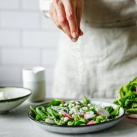 close-up of a woman making healthy summer green salad in kitchen - food stock pictures, royalty-free photos & images