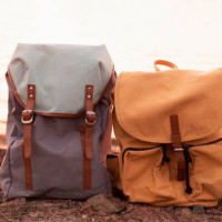 close-up of backpack on rock against sea - fashion stock pictures, royalty-free photos & images