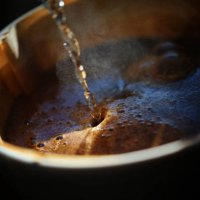 close-up of brewing coffee using a pour-over technique - coffee stock pictures, royalty-free photos & images