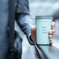 close-up of businessman holding recycable takeaway coffee cup - junk food stock pictures, royalty-free photos & images