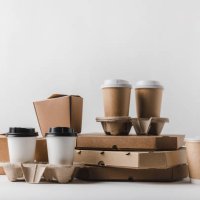 close-up of cardboard boxes on table against white background,romania - junk food stock pictures, royalty-free photos & images