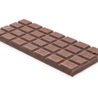 close-up of chocolate bar against white background,romania - junk food stock-fotos und bilder