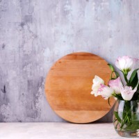 close-up of eustoma flowers in vase on table against wall - garden decoration stock pictures, royalty-free photos & images