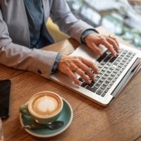close-up of female hands, working online, typing on laptop - coffee stock pictures, royalty-free photos & images