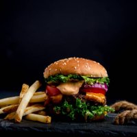 close-up of hamburger with black background - junk food stock pictures, royalty-free photos & images
