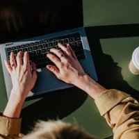 close-up of hands typing on a laptop computer - coffee stock pictures, royalty-free photos & images