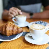 close-up of man having breakfast in a cafe - junk food stock pictures, royalty-free photos & images