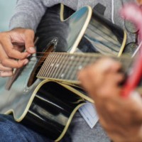 close-up of person playing guitar - concert stock pictures, royalty-free photos & images