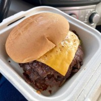 close-up of smashburger in to-go box inside car - junk food stock pictures, royalty-free photos & images