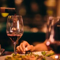 close-up of sommelier serving red wine at fine dining restaurant - food stock pictures, royalty-free photos & images