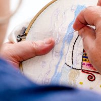 close-up of the hands of an elderly woman embroidering on a fabric. tr - nails art stock pictures, royalty-free photos & images