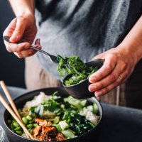 close-up of woman eating omega 3 rich salad - food stock pictures, royalty-free photos & images