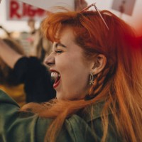 close-up of young woman shouting while protesting for rights - fashion stock pictures, royalty-free photos & images