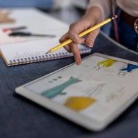 close-up on a fashion designer sketching at her atelier - fashion stock pictures, royalty-free photos & images