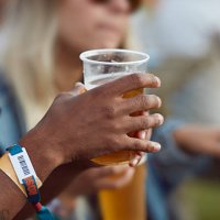 close-up uf hands holding beer, at festival - concert stock pictures, royalty-free photos & images