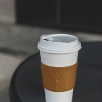 close-up view of paper coffee cup on table - junk food stock pictures, royalty-free photos & images