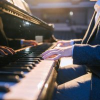 close up asian talented chinese pianist finger playing performing on stage - concert stock pictures, royalty-free photos & images
