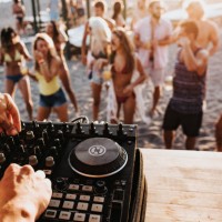 close up of a dj playing music on the beach party. - concert stock pictures, royalty-free photos & images