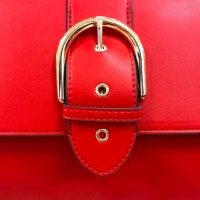close up of a red purse detail showing belt buckle design on flap - fashion stock pictures, royalty-free photos & images